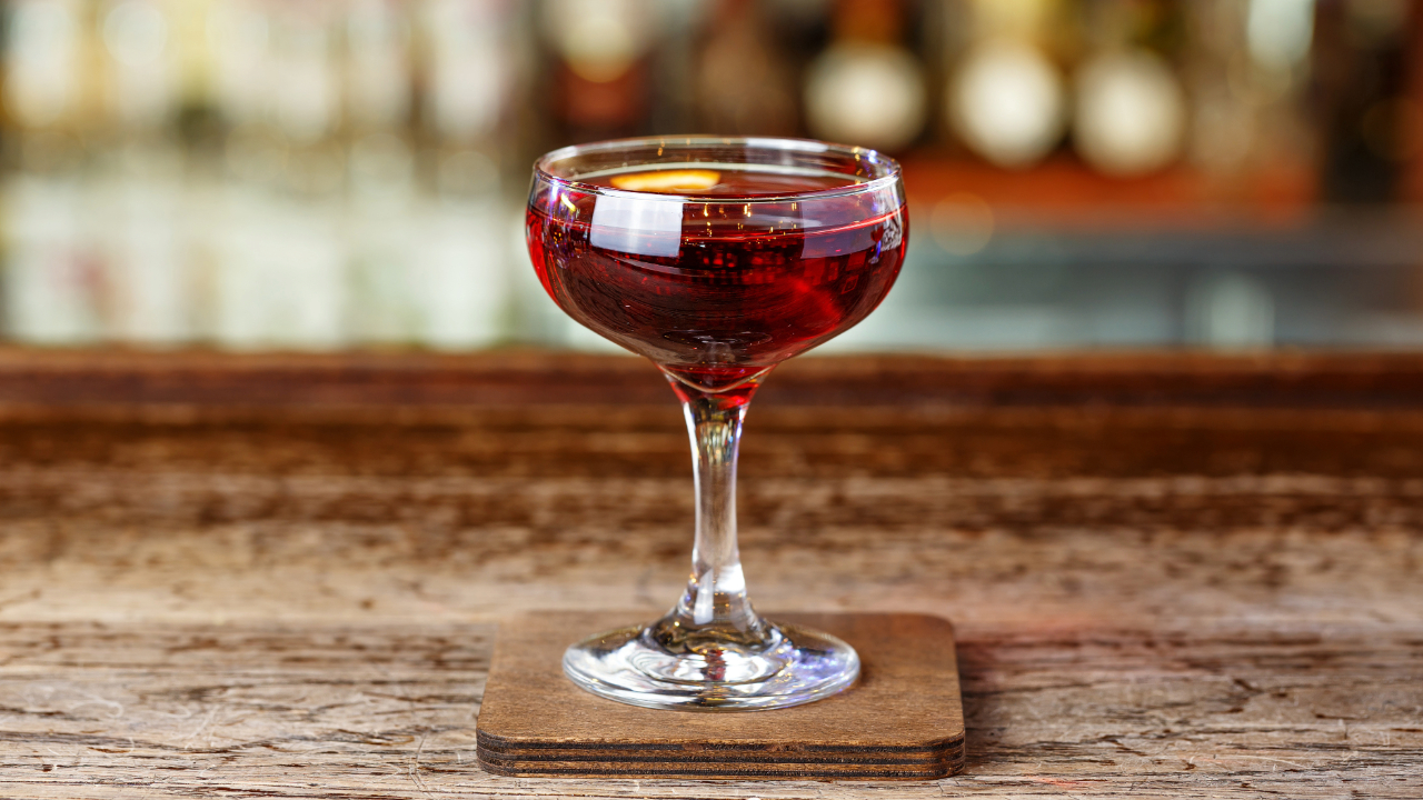 A close up of a Manhattan cocktail on a bar, one of the best drinks of 2024