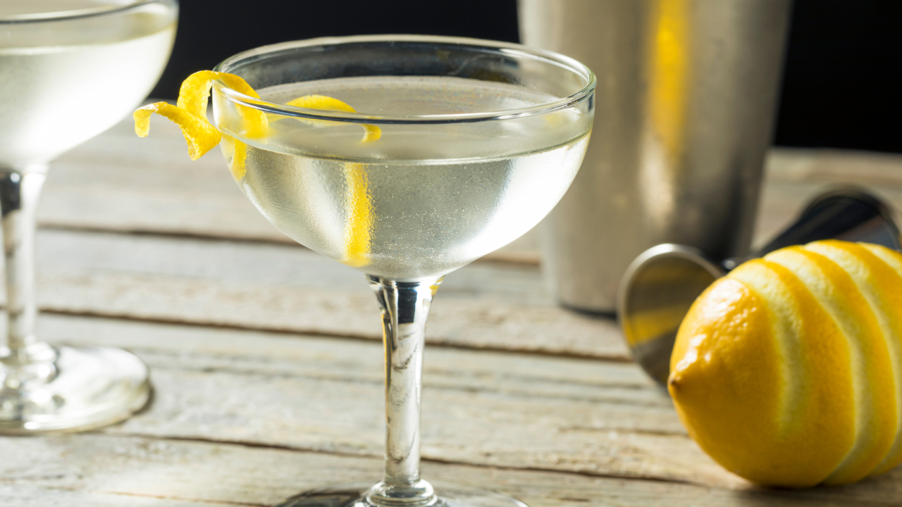 A close up of a Vesper Martini, one of the best bar drinks of 2024, with a lemon garnish