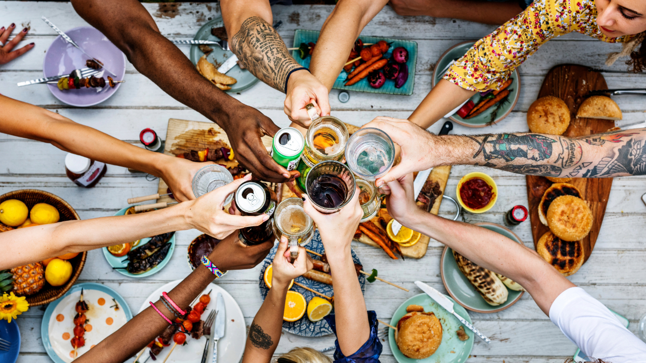 Friends gathered around toasting with fine spirits and good food.