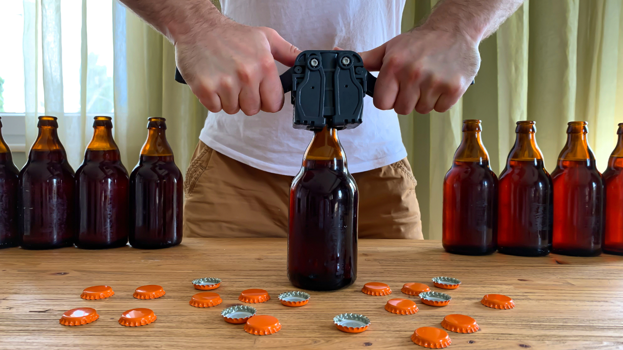 A shot of a man bottling his homebrew beer
