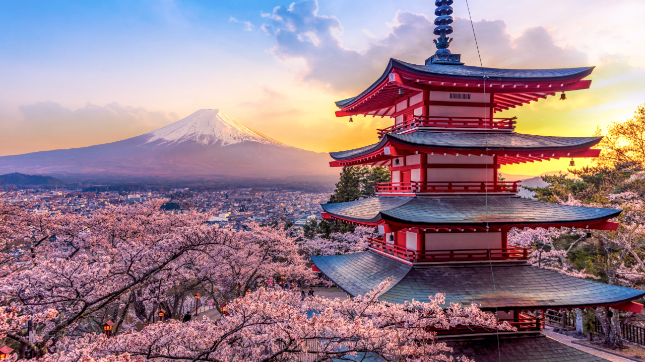 A shot of a traditional Japanese building overlooking a volcano