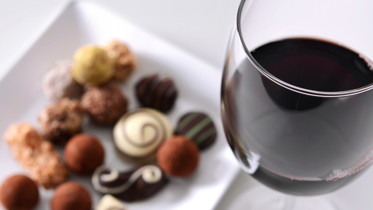 A picture of fancy chocolates with wine, one of the most famous food and wine pairings